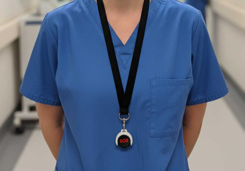 Worker activating personal safety alert button